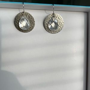 Hammered silver tone drop earrings with crystal